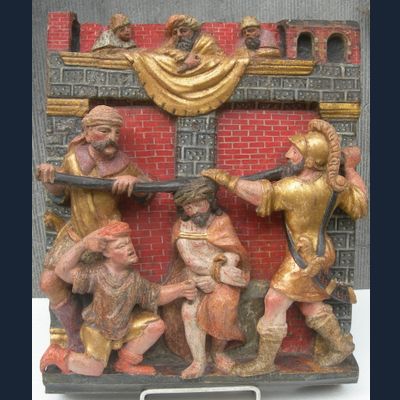 A POLYCHROME CARVED WOODEN RELIEF  1 of 2