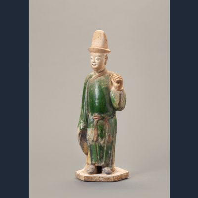 A Chinese green-glazed pottery figure of a tomb attendant