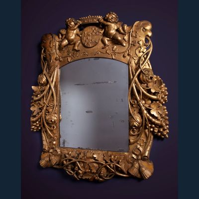 A Louis Quartorze mirror with a coat of arms of VOC governor Cornelis Kien