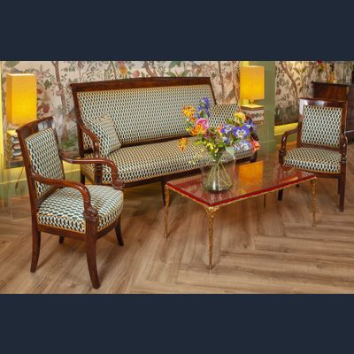 A FINELY CARVED MAHOGANY EMPIRE SOFA “AUX DAUPHINS” AND TWO FAUTEUILS