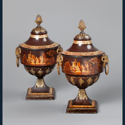 A pair of Dutch Empire tole chestnut urns