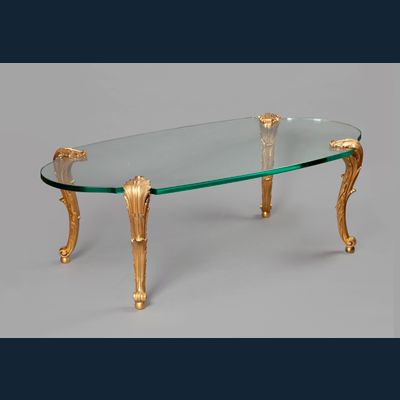 A gilt bronze and glass coffee table – Signed P.E. Guerin New York