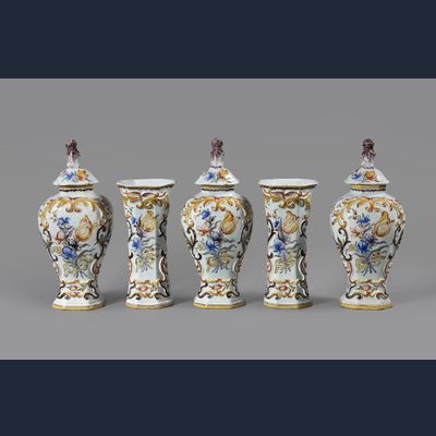 A Dutch Delft polychrome five-piece vase garniture decorated with Dutch tulips