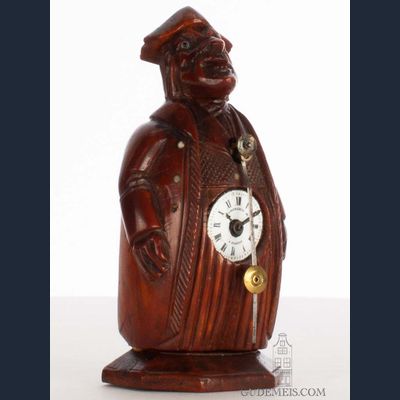 A rare small French walnut sculptural ‘zappler’ table clock, Neuburger & Cie, circa 1840
