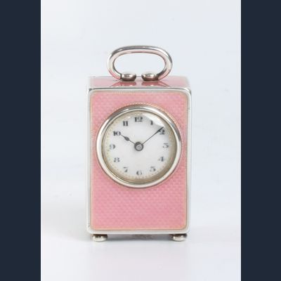 A miniature Swiss silver pink translucent guilloche enamel timepiece, circa 1900.