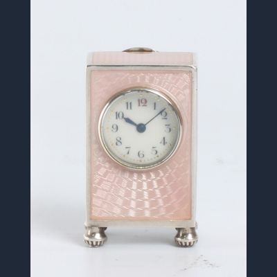 A miniature Swiss silver pink translucent guilloche enamel timepiece, circa 1900.