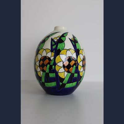 Charles Catteau, Boch Keramis, white ceramic vase with colored stylized flowers and leaves. Décor 1265