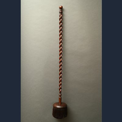 A 17th century brush with round head and twisted handle
