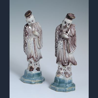 A pair of Delftware chinoiserie sculptures