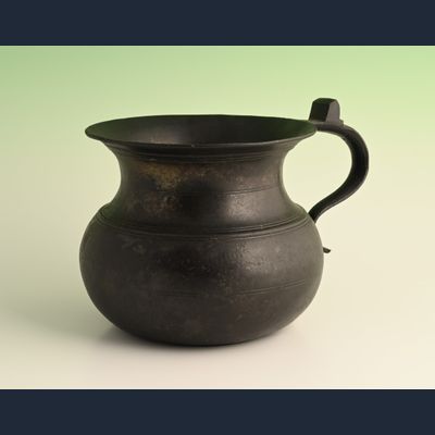 A pewter chamber pot