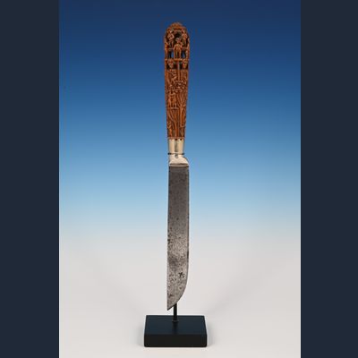 An extremely finely carved palm wood knife
