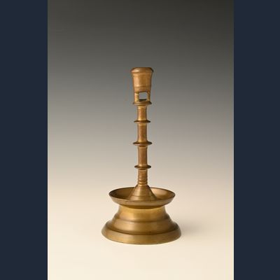 A Dutch bronze candlestick