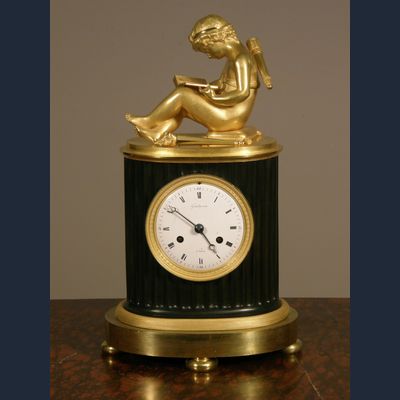 A small French Empire patinated and ormolu sculptural mantel clock Grandperrin à Perrin circa 1805.