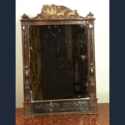 Een spiegel in houten lijst, mogelijk voormalig vertrek- en aankomsttijden lijst, ca 1880.