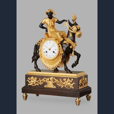 Unusual French ‘Directoire' gilt and patinated bronze mantel clock with young Arab on mule, circa 1800