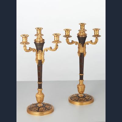A rare pair of European four-light gilt bronze ‘Directoire’ candlesticks, circa 1810