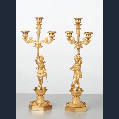 A pair of French bronze ‘Paul and Virginie’ candlesticks, circa 1830