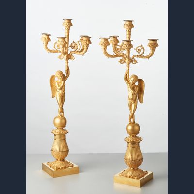 A pair of French bronze five-arm candlesticks with angels, circa 1830