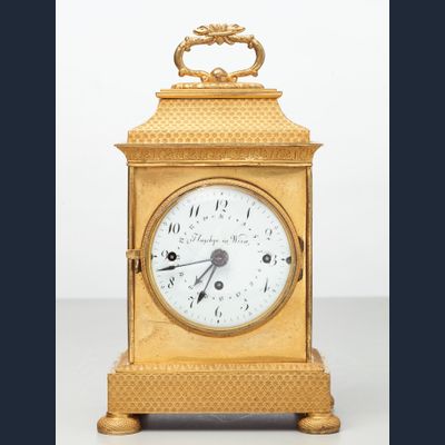 A small Vienna bronze gilt travelling clock by Tobias Flaschge, circa 1810