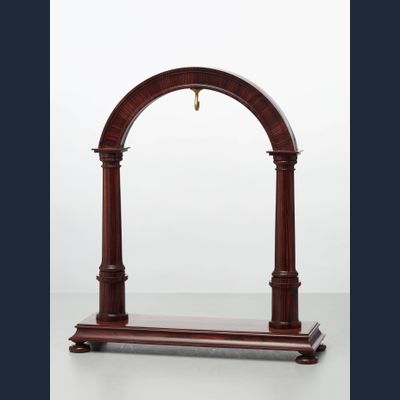 An elegant walnut contemporary custom made stand for displaying a watch