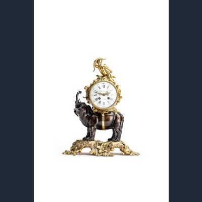 This is a very nice and highly decorative 19th-century mantel clock featuring an elephant carrying the clock on its back