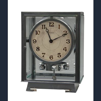 M127 Nickel five glasses ATMOS Clock champagne coloured  dial, Arabic numerals. On the back numbered 6972 and signature Brevet J.L. Reutter, S.G.D.G., made in Paris.