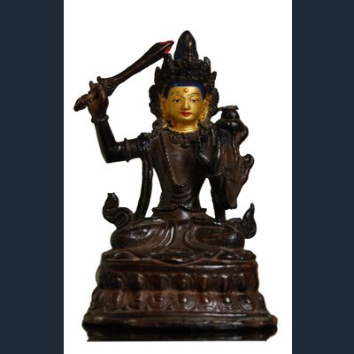 Oda 36 Chino-Tibetan gilt bronze figure of a deity