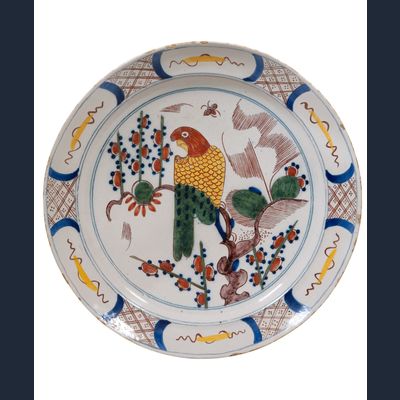 A Polychrome Dutch Delft Charger Depicting a Parrot
