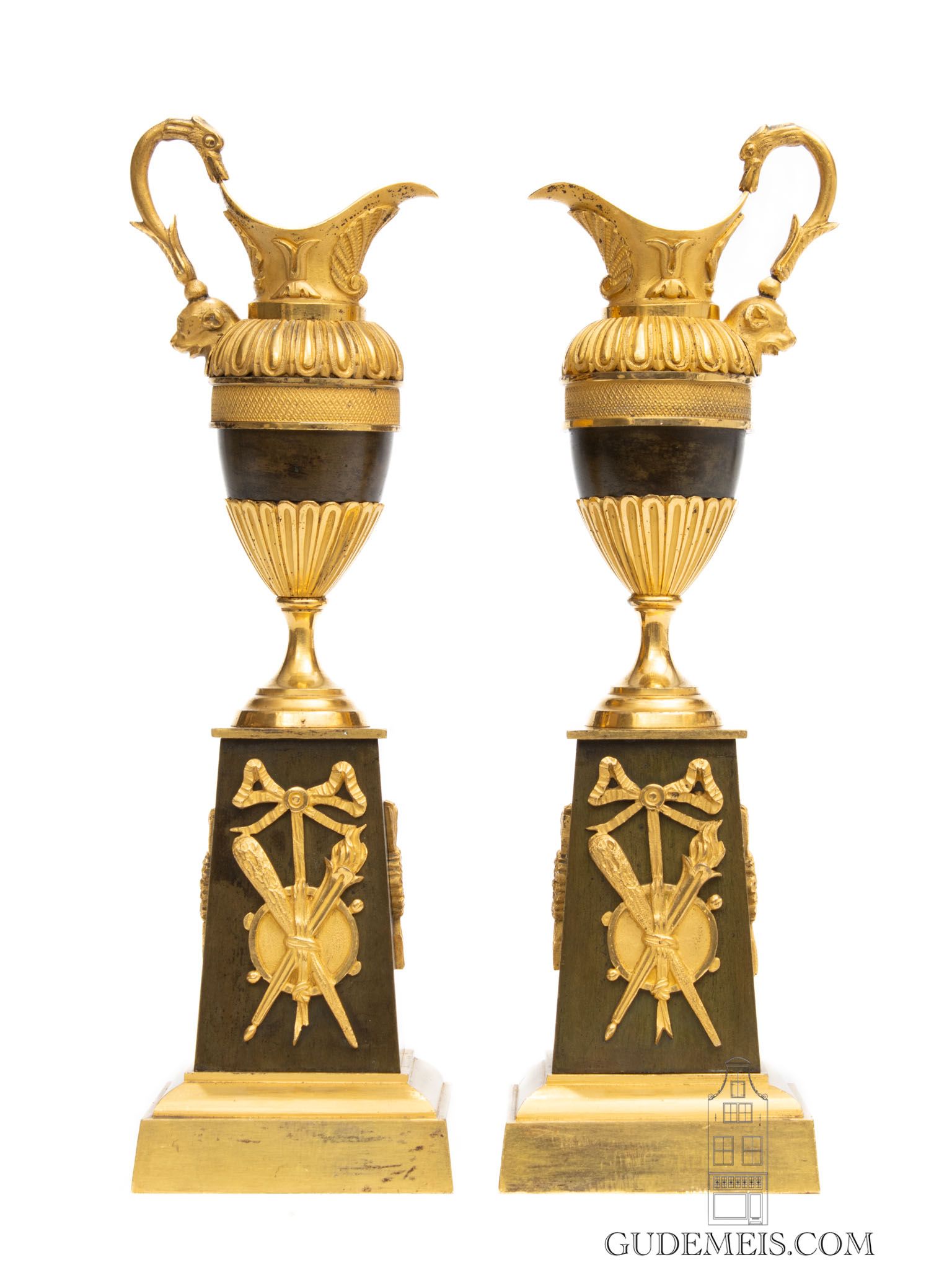 A pair of French Restoration gilt and bronze ewers/candle sticks, circa 1825