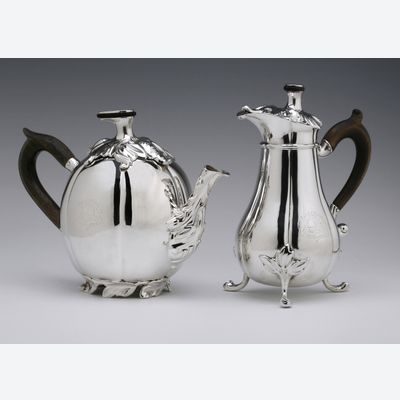 An antique Dutch silver teapot and milk jug