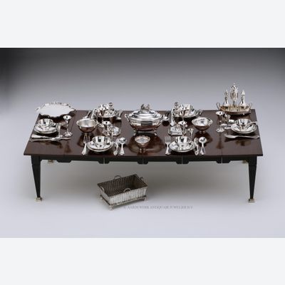 A miniature table set for six with antique Dutch silver miniature silver