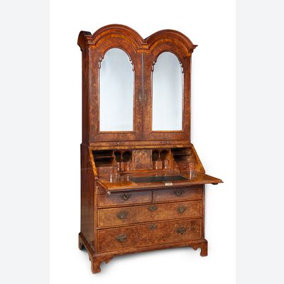 A Walnut double domed bureau bookcase
