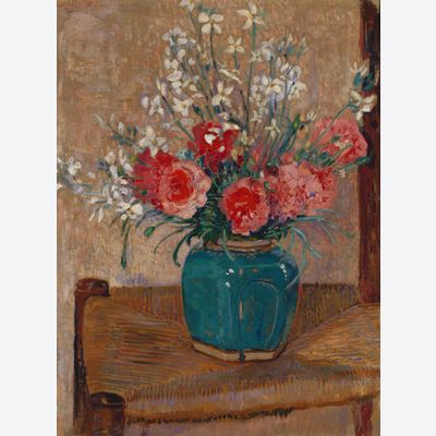 Flowers in a pot on a cane chair