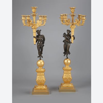 A stunning pair of French Empire gilt and patinated bronze five-light candelabra