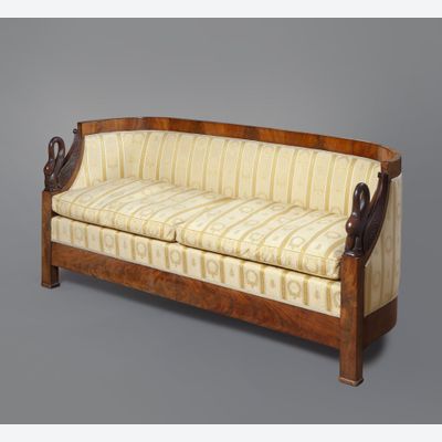 A mahogany Empire sofa with carved swans