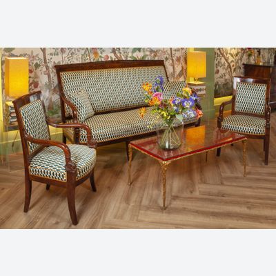 A FINELY CARVED MAHOGANY EMPIRE SOFA “AUX DAUPHINS” AND TWO FAUTEUILS