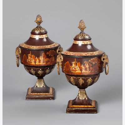 A pair of Dutch Empire tole chestnut urns