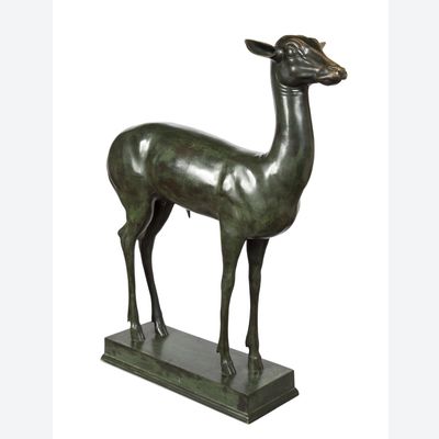 An elegant bronze sculpture of a fawn