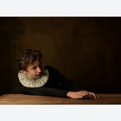 Boy with white Collar at Table