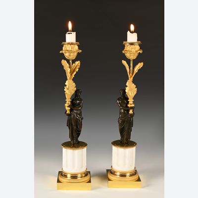 A pair of ormolu and patinated bronze candlesticks
