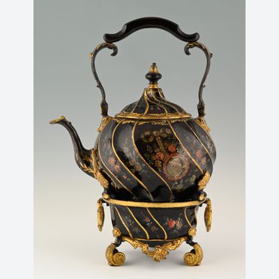 A pewter bouilloire on a stand.