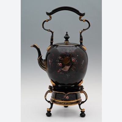 A  pewter bouilloire on a stand