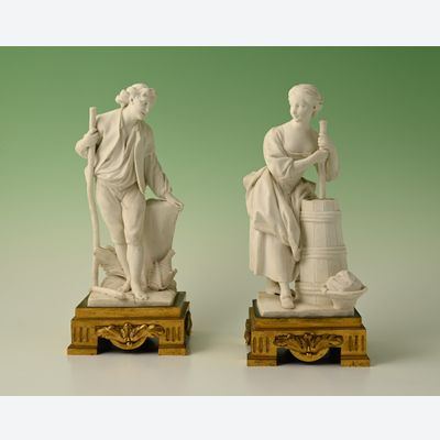 Een paar decoratieve biscuit-porseleinen beeldjes