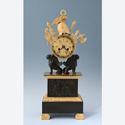 An Empire mantel clock with military trophies