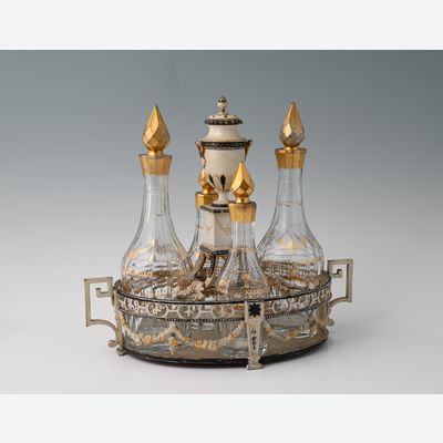 Een gelakt tinnen Hollands olie- en azijnstel