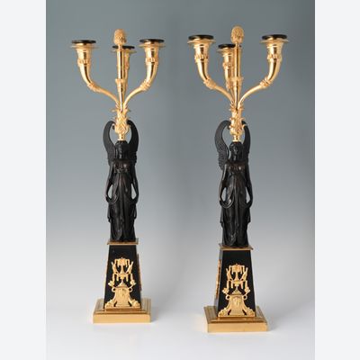 A pair of decorative candle holders