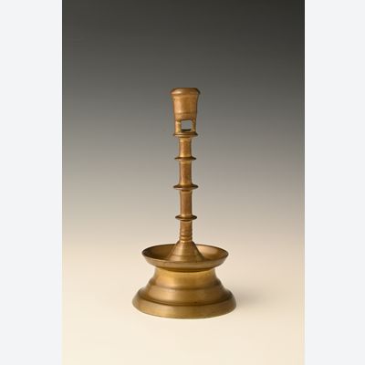 A Dutch bronze candlestick