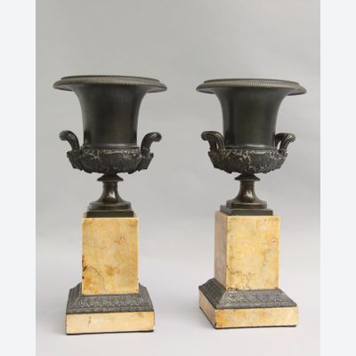 Bronze Medici vases on marble bases