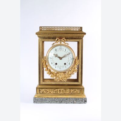 An impressive French Louis XVI-style gilt bronze and marble mantel clock