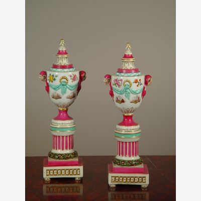 A pair of polychrome porcelain urns 'à double usage', mid 19th Century.